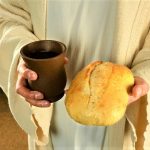 bigstock Jesus hands holding bread and 52725442