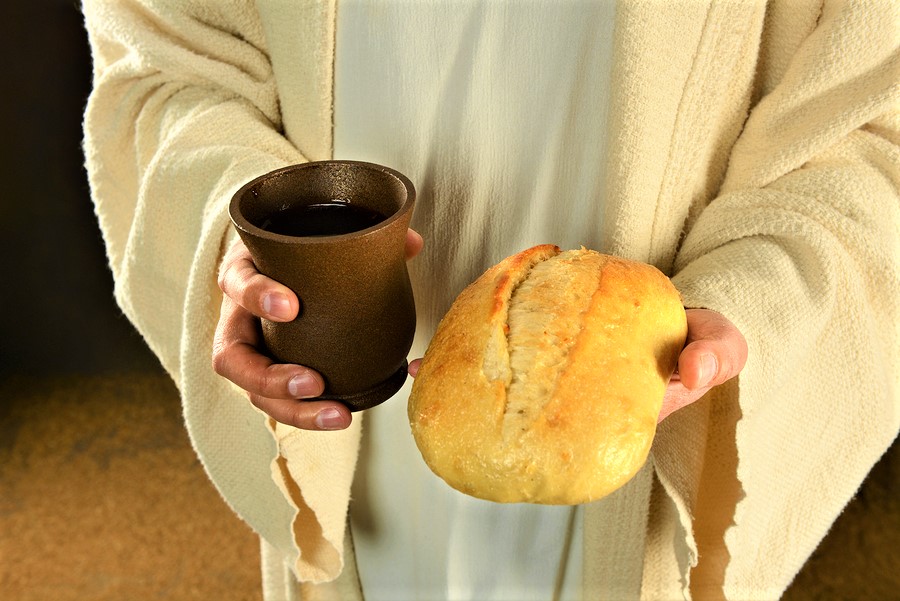 bigstock Jesus hands holding bread and 52725442