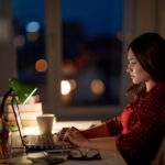 student or woman typing on laptop at night home 2021 08 26 22 49 57 utc