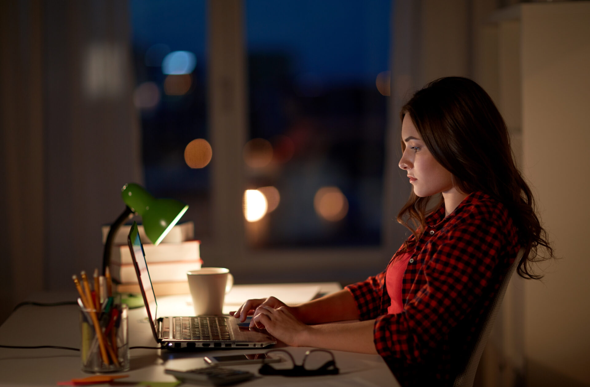student or woman typing on laptop at night home 2021 08 26 22 49 57 utc