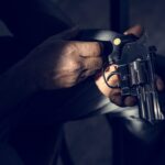 hands holding the gun 2021 08 27 00 02 47 utc