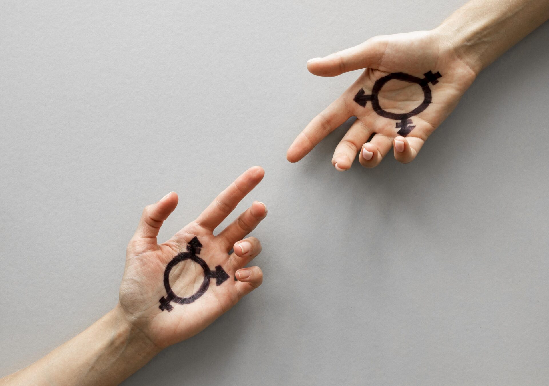 hands with transgender sign