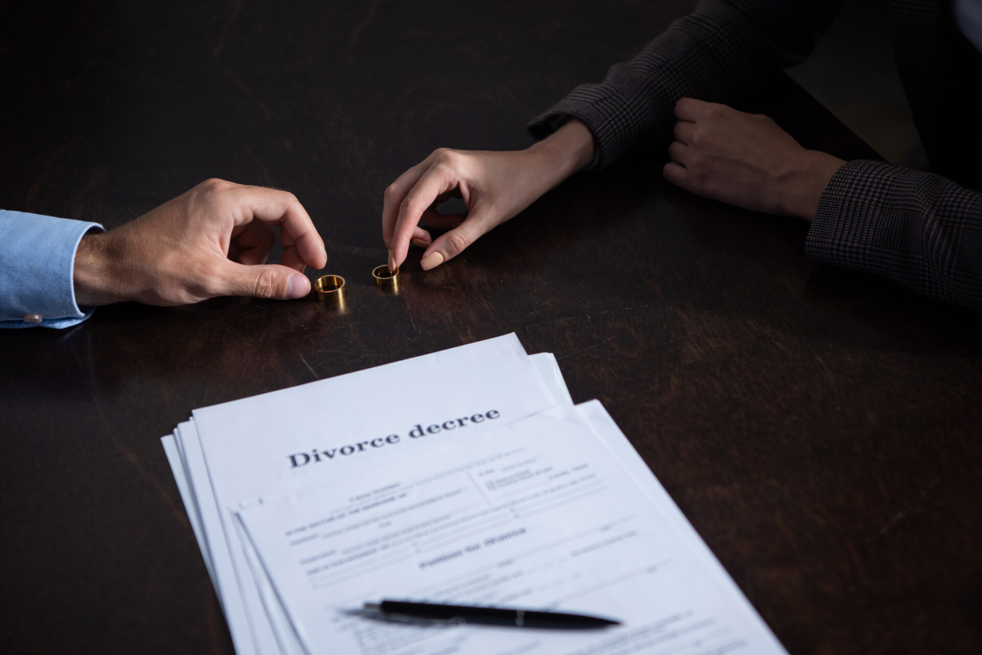 partial view of couple at table with divorce docum 2021 09 03 16 43 39 utc