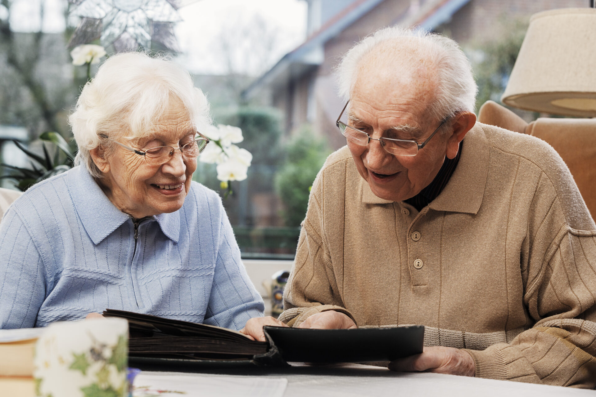 senior couple watching old photographs at home 2022 03 08 01 04 05 utc