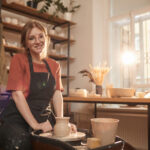 smiling female potter in sunlight 2021 09 24 04 13 22 utc