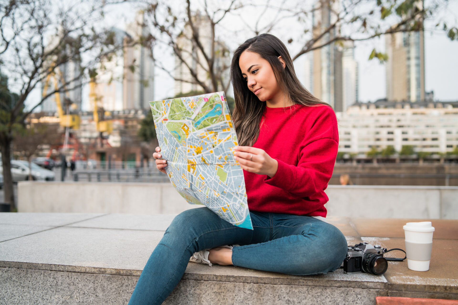 young latin woman with a map 2021 08 30 01 21 00 utc
