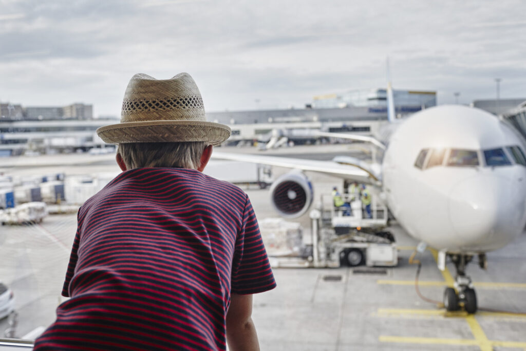 boy wearing straw hat looking through window to ai 2022 03 08 01 27 31 utc