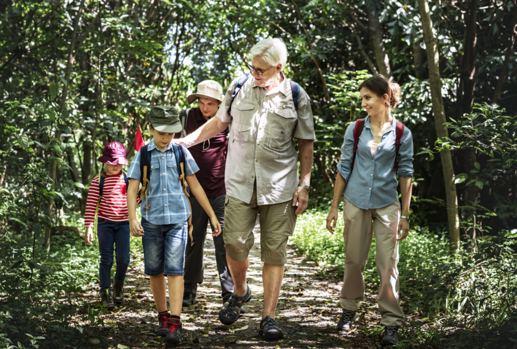 family hiking in a forest 2022 09 16 09 03 34 utc