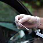 hands of nurse testing for coronavirus at mobile t 2021 10 16 11 17 08 utc