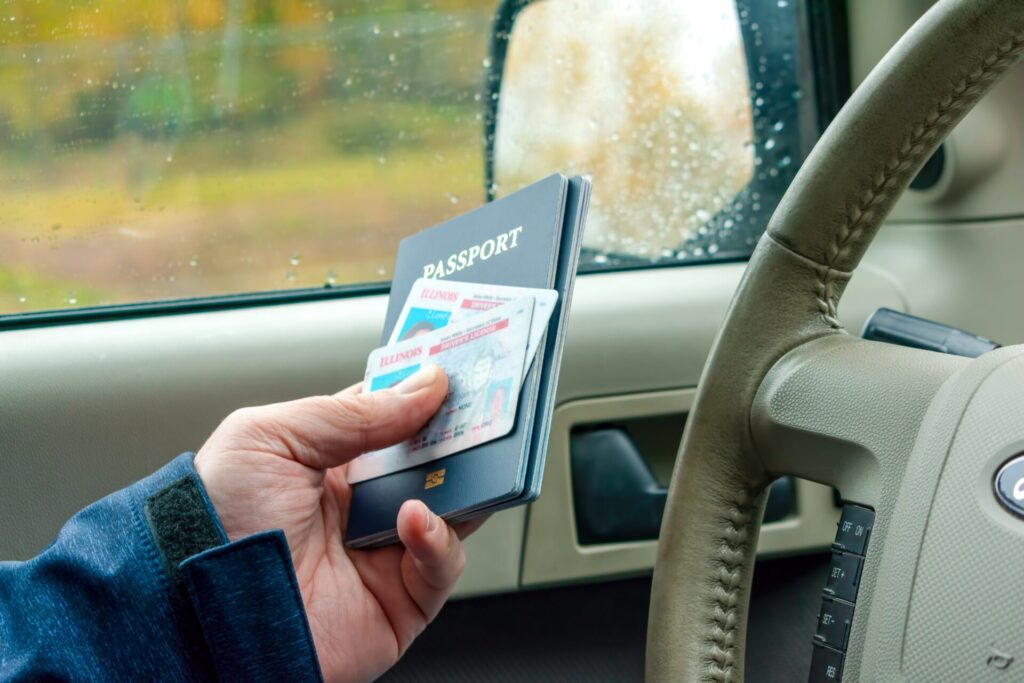 man in car providing passport and identification a 2022 08 01 01 08 30 utc