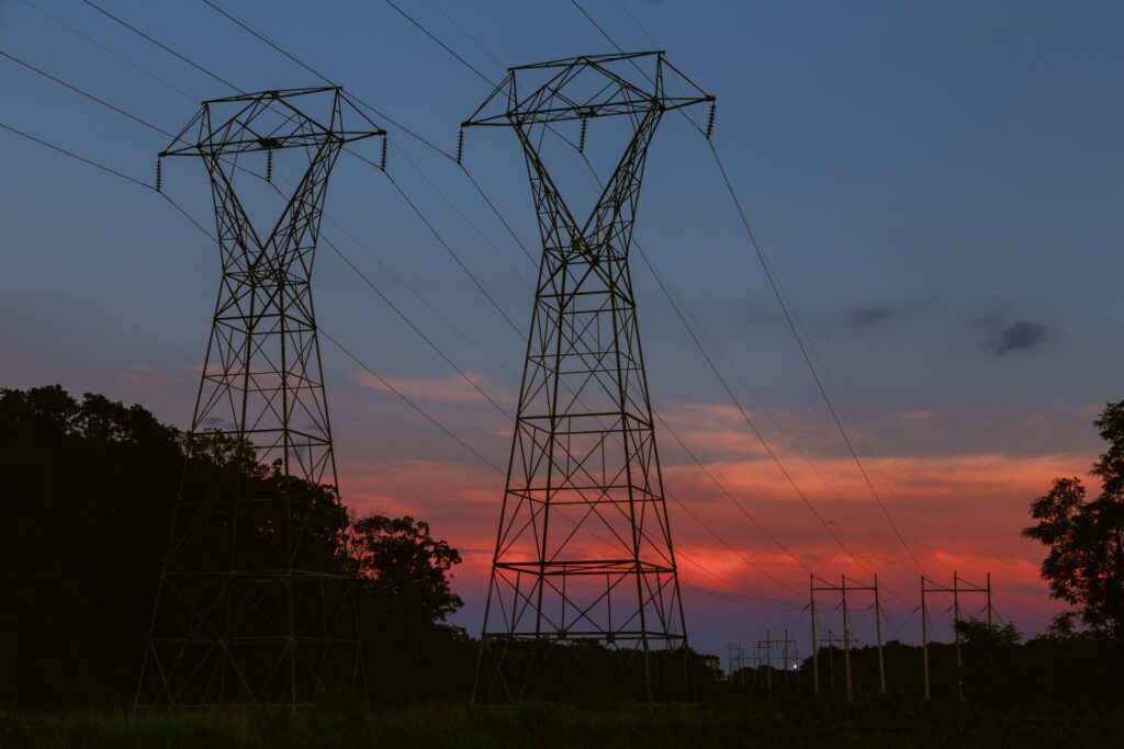 power transmission tower silhouetted against the s 2022 08 01 04 00 32 utc 1