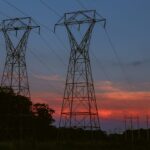power transmission tower silhouetted against the s 2022 08 01 04 00 32 utc