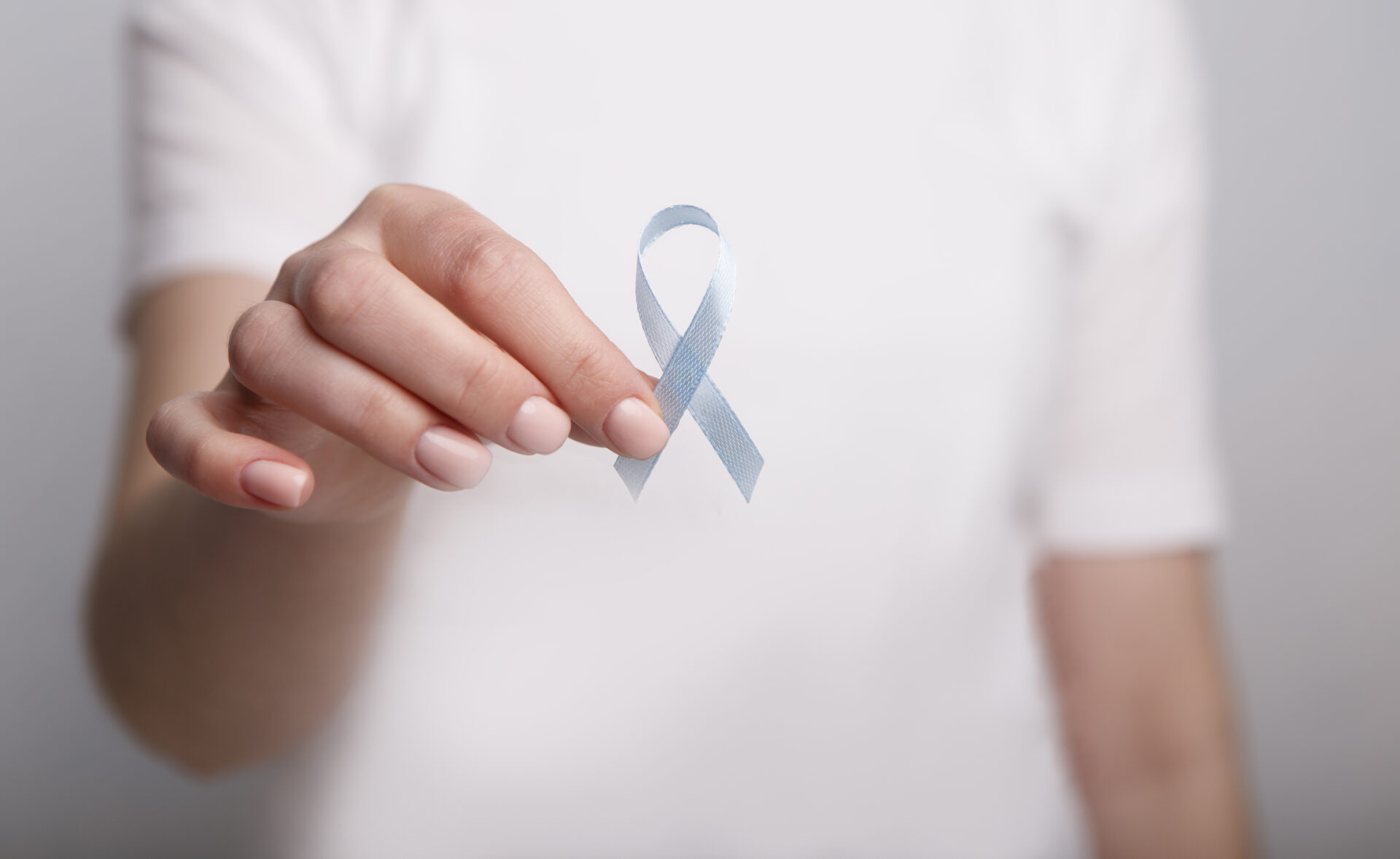 woman holding blue ribbon child abuse awareness 2021 08 28 12 48 09 utc