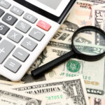 calculator and magnifier on money 2021 09 03 10 17 18 utc