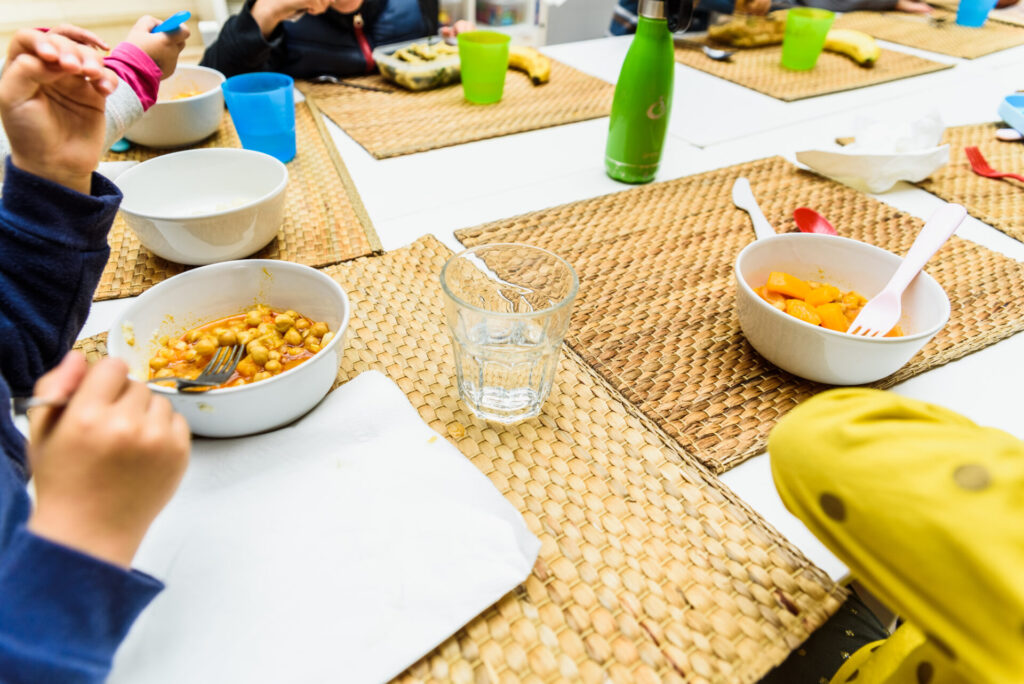 children sitting at the table in a school cafeteri 2022 05 06 01 50 21 utc