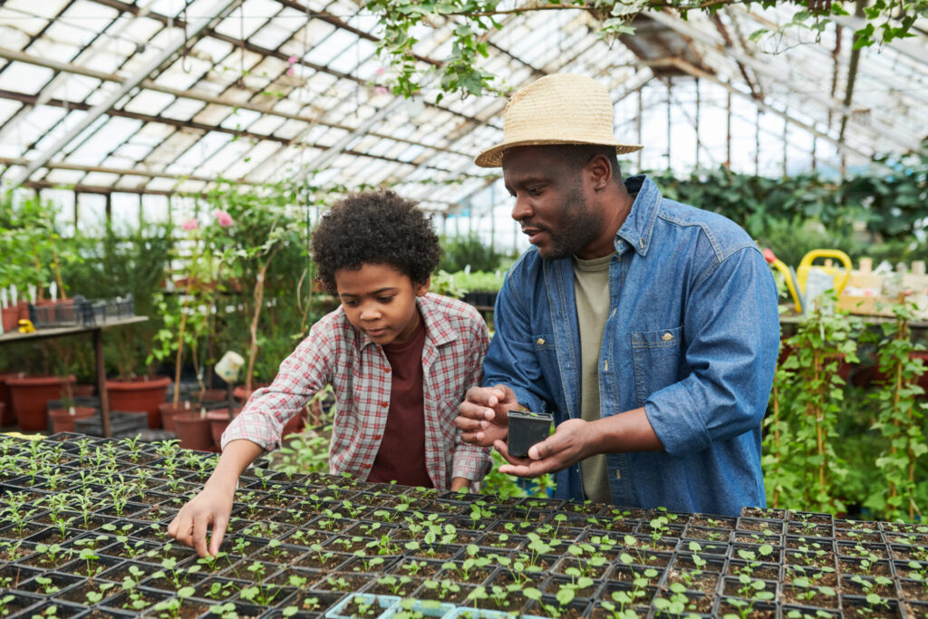 man with child in greenhouse 2022 02 01 22 36 19 utc