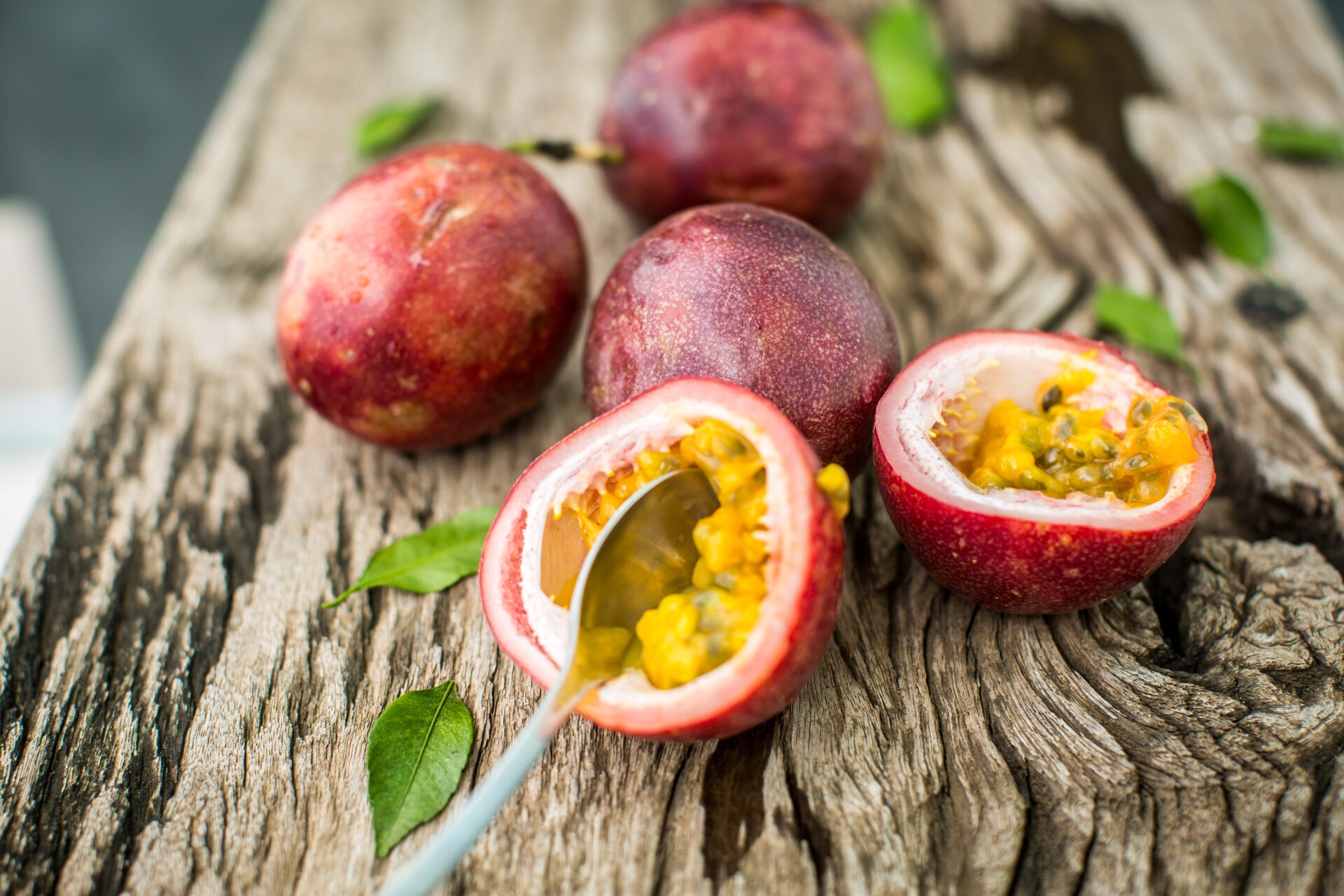 passion fruit on a wooden board with knife 2021 09 03 03 03 35 utc