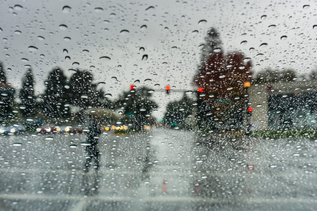 pedestrian crossing the street on a rainy day cal 2021 08 30 16 43 32 utc