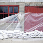 sandbags and glass sheet on building wall 2022 03 04 02 36 51 utc