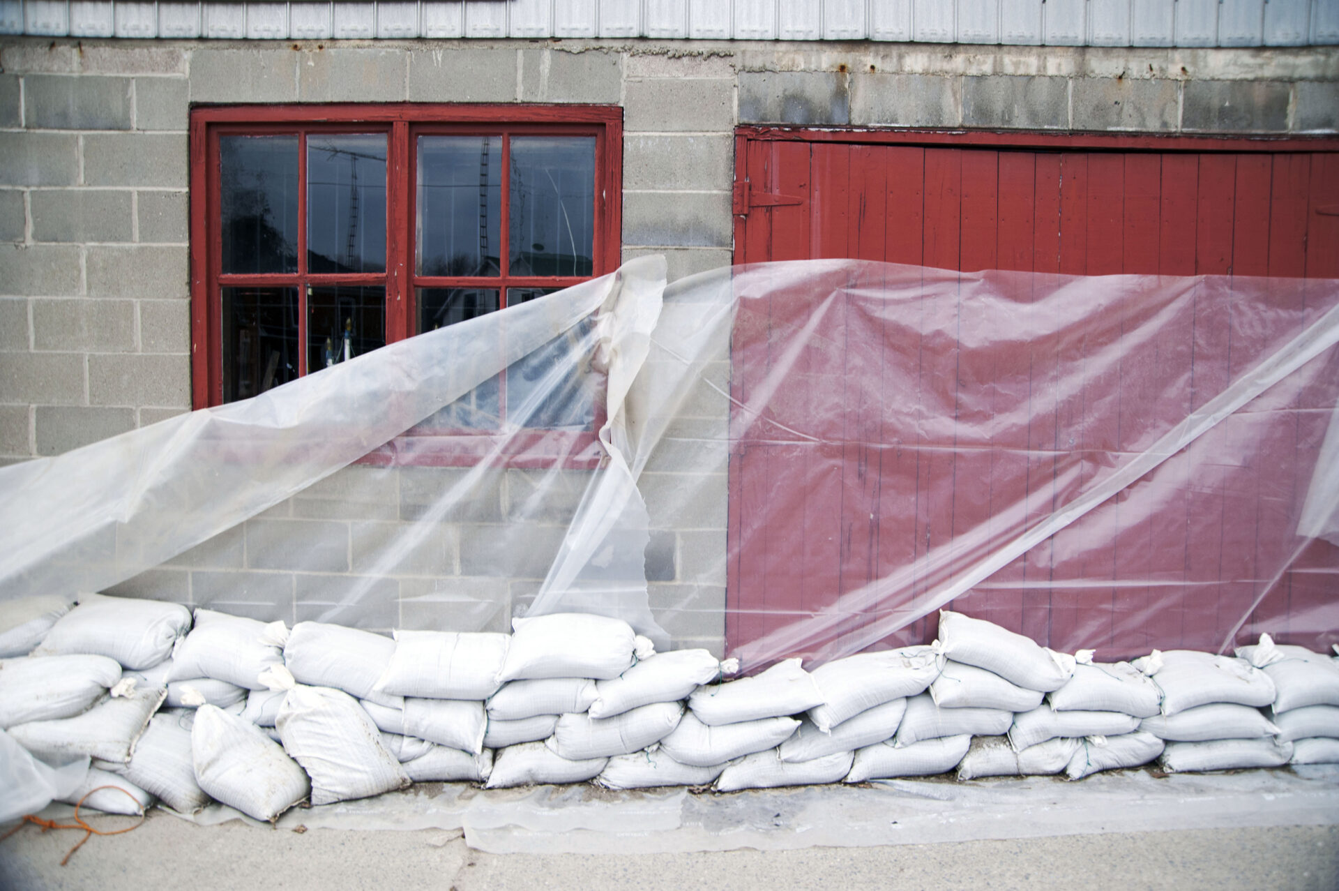 sandbags and glass sheet on building wall 2022 03 04 02 36 51 utc