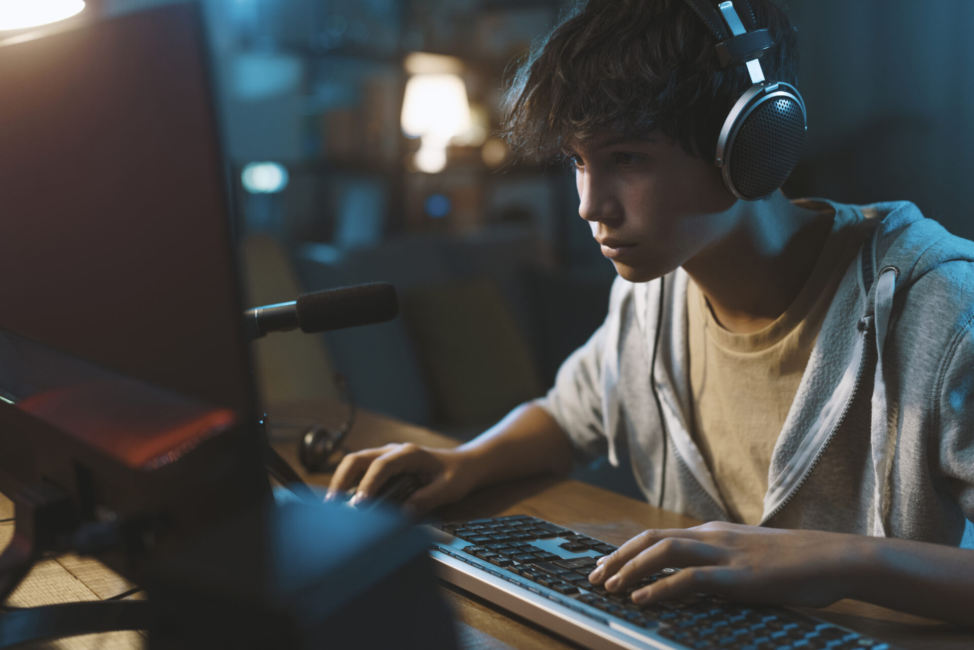 teenager wearing headphones and playing online vid 2022 01 19 00 21 34 utc