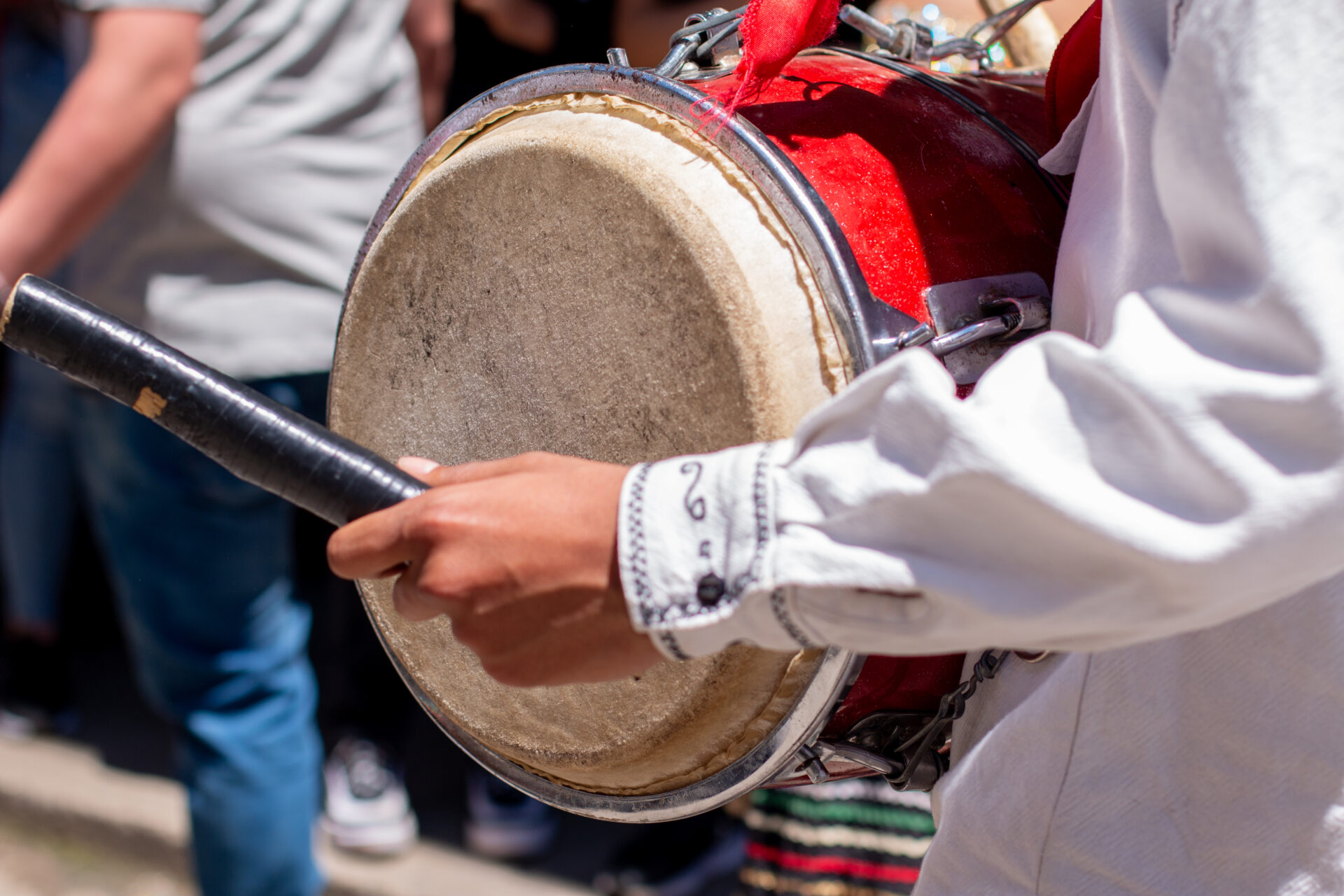 close up of a man playing a bass drum at a colombi 2022 08 17 18 01 55 utc