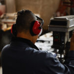 female worker wearing ear protection at factory 2022 09 26 21 02 01 utc