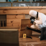forensic investigator documenting evidence with ca 2022 11 02 04 17 21 utc