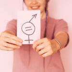 girl holding paper with gender equality sign again 2022 07 14 16 03 15 utc