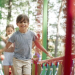 group of kids playing at the playground in summer 2022 08 14 04 48 20 utc