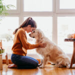 beautiful woman hugging adorable golden retriever 2022 04 01 22 13 24 utc
