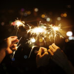 celebrating with sparklers in the night
