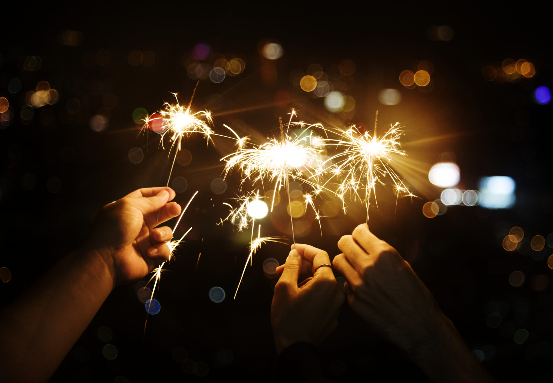 celebrating with sparklers in the night
