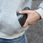 drug dealer taking bag with cocaine out of hoodie 2022 11 14 15 59 26 utc