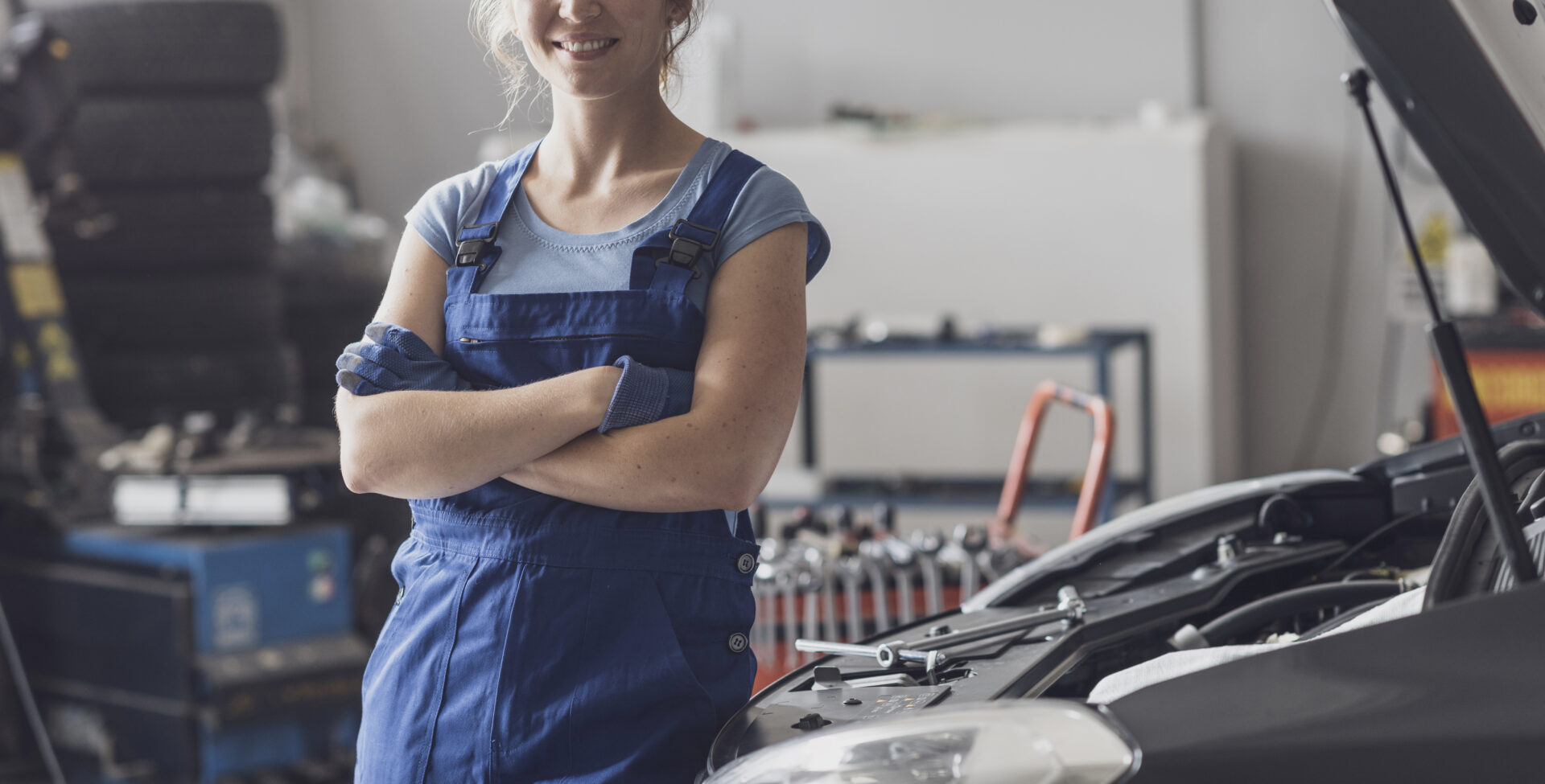 female mechanic posing next to a car 2022 01 19 00 21 36 utc
