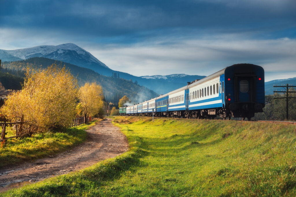 moving train in mountains at sunset in autumn 2021 09 01 15 56 07 utc