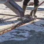 worker pouring concrete mix at home foundation 2022 10 11 20 11 57 utc