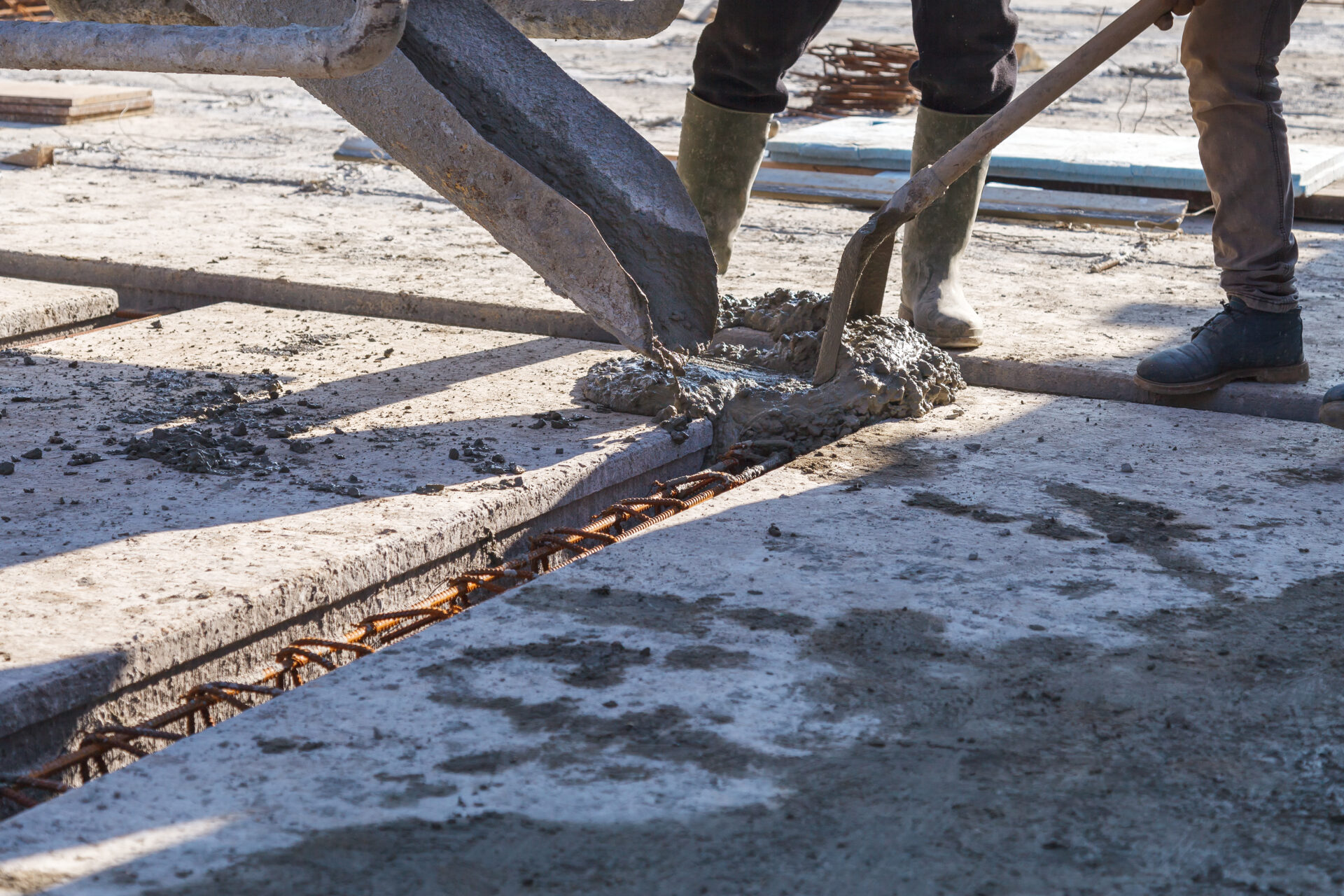 worker pouring concrete mix at home foundation 2022 10 11 20 11 57 utc