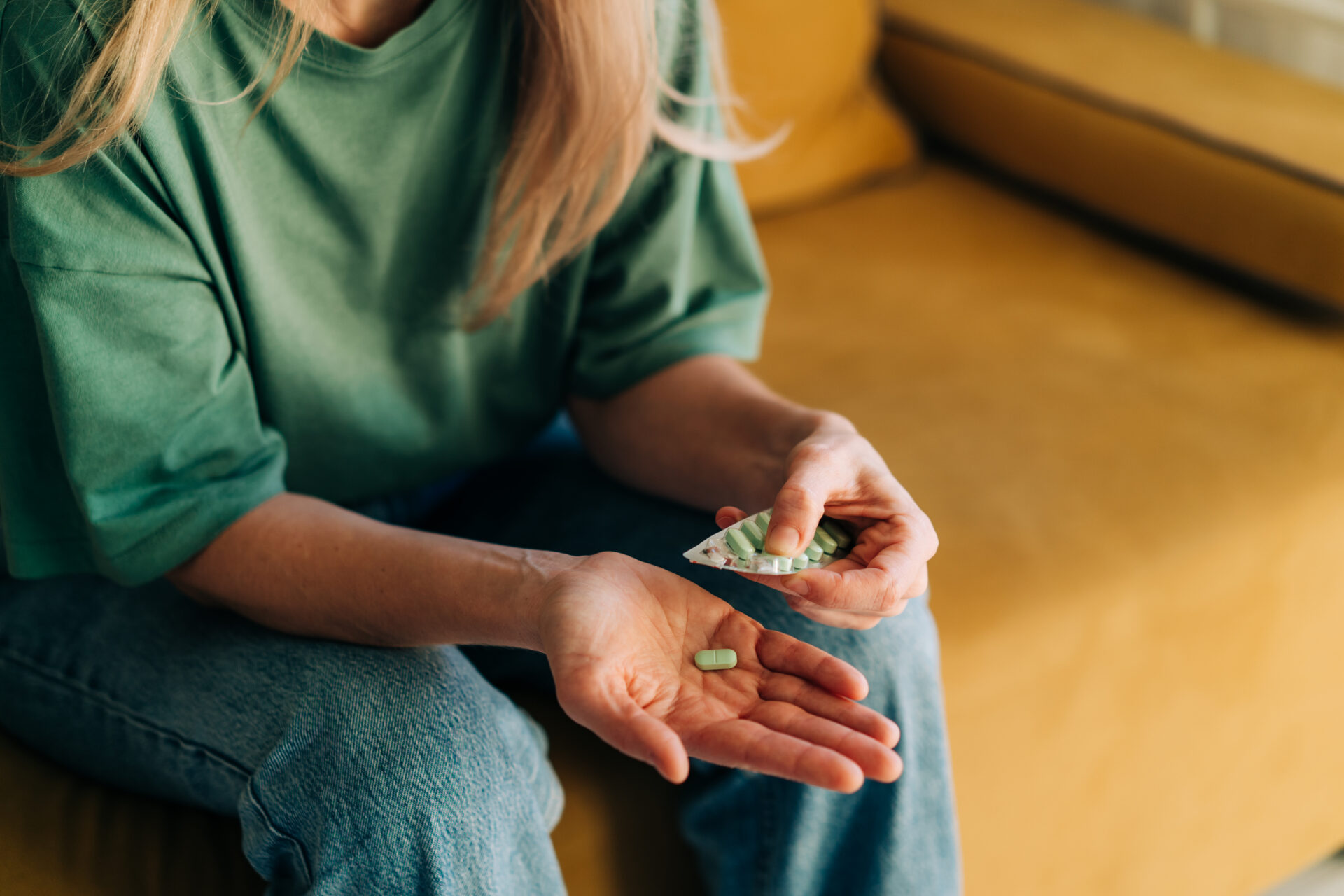 close up of a woman holding pills 2023 01 23 23 12 17 utc