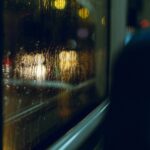 inside of a bus with a view of a window and raindr 2023 01 06 01 54 40 utc