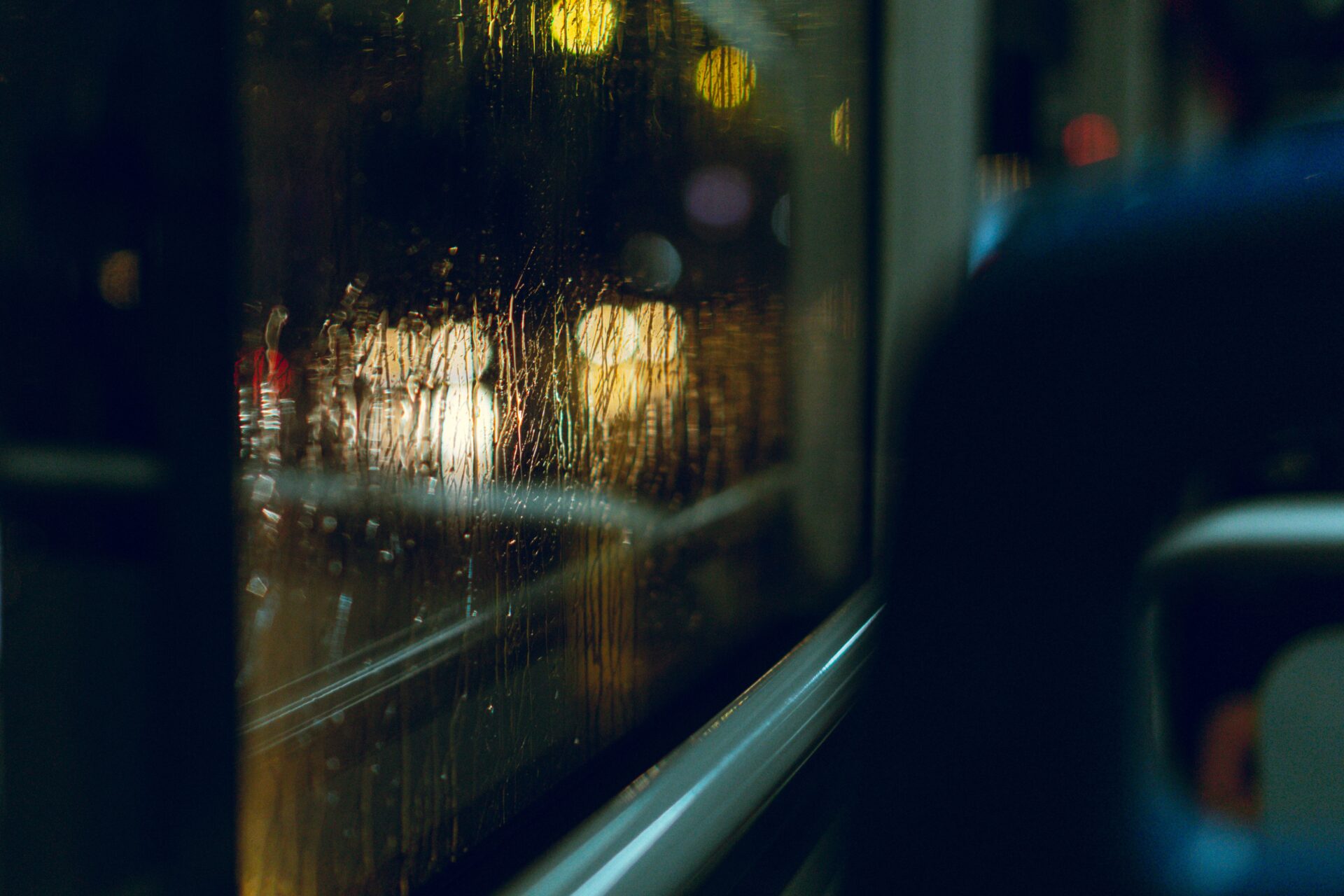 inside of a bus with a view of a window and raindr 2023 01 06 01 54 40 utc