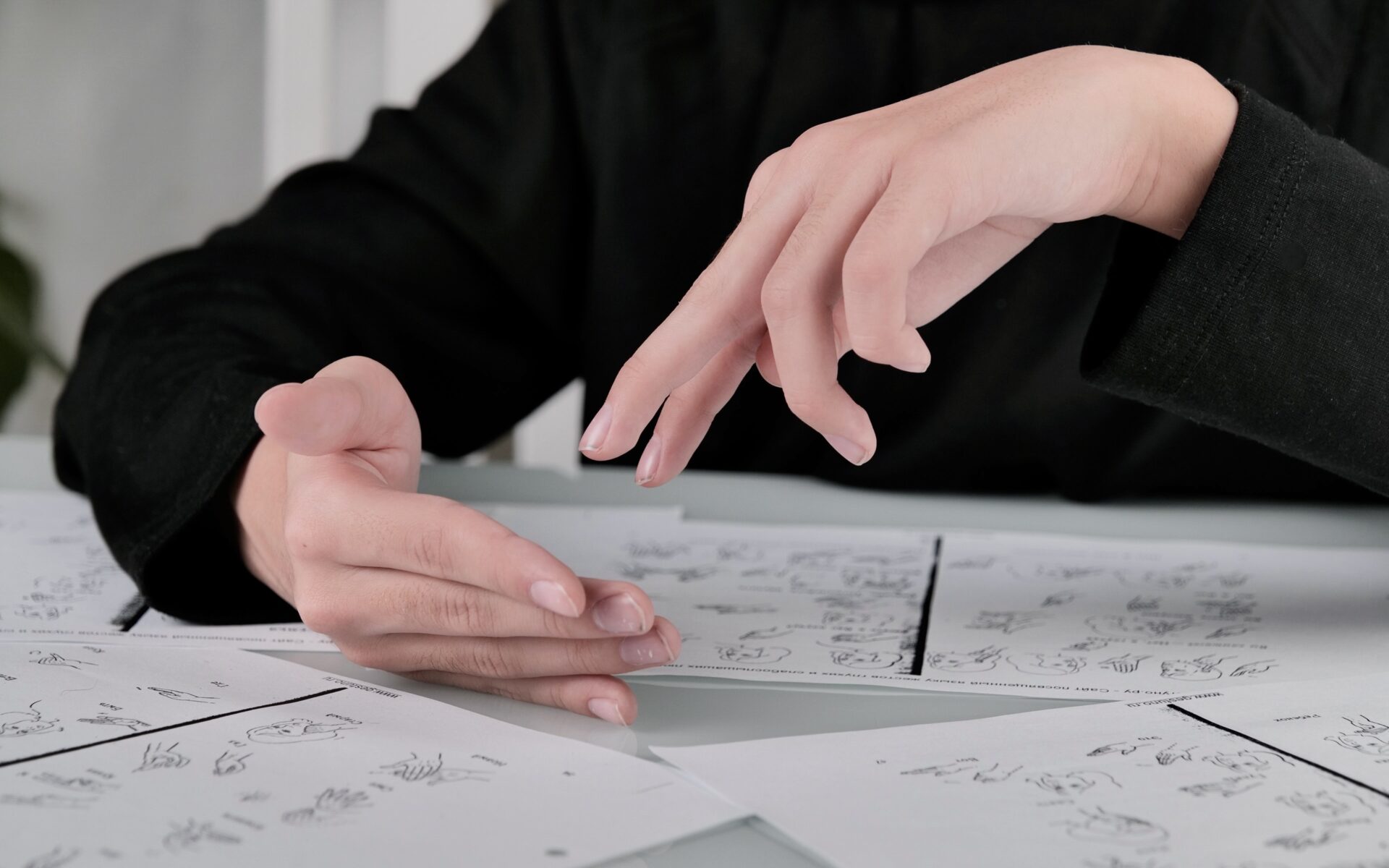 hands of a teenager show a word in sign language i 2022 10 31 23 23 06 utc