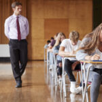 teenage students sitting examination with teacher 2022 03 30 20 23 48 utc