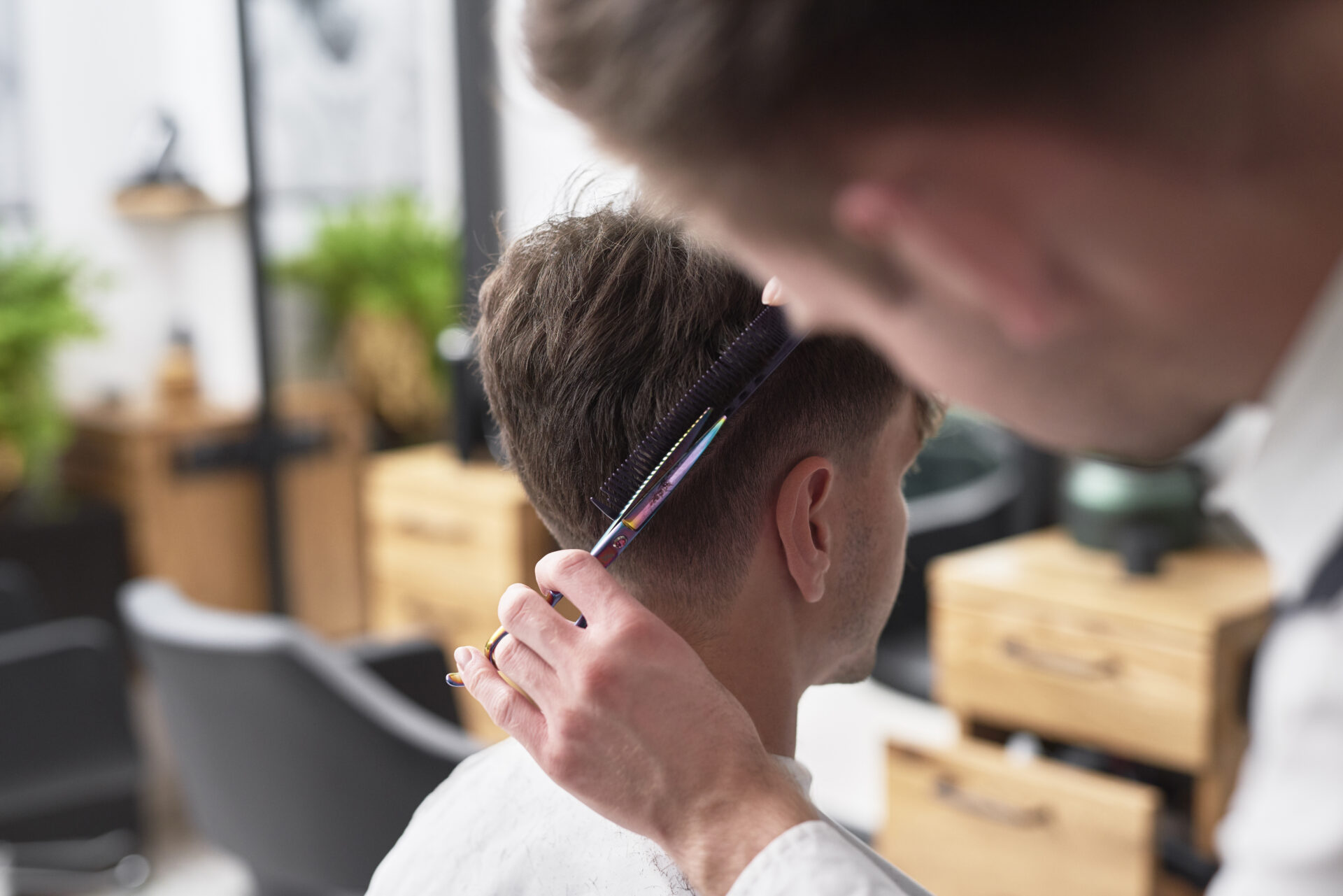 young man has cutting hair at the hairdresser 2021 08 27 09 09 44 utc