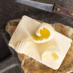 butter on paper fresh butter and knife 2022 09 26 23 07 41 utc