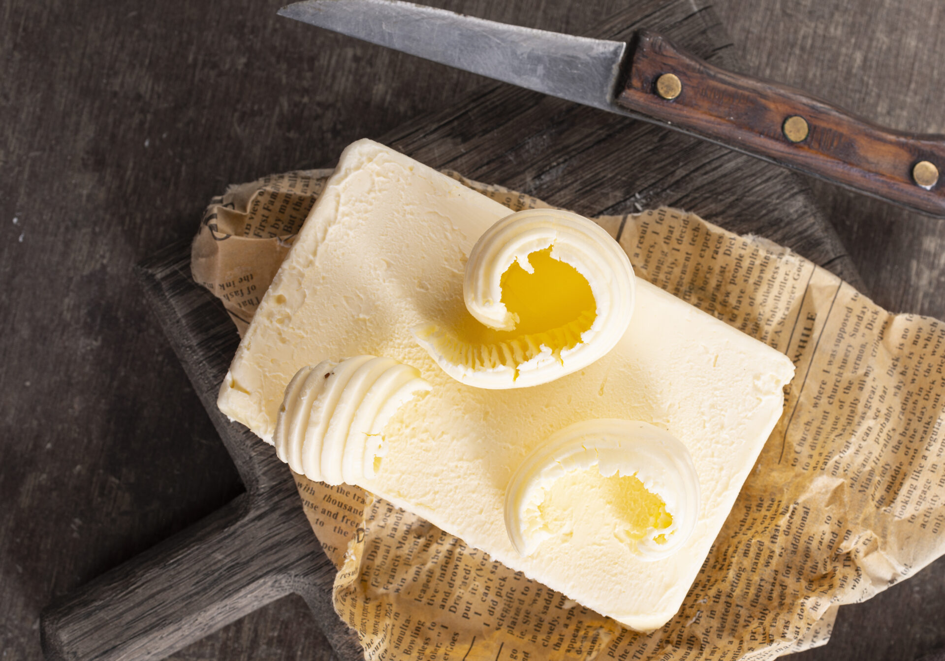 butter on paper fresh butter and knife 2022 09 26 23 07 41 utc