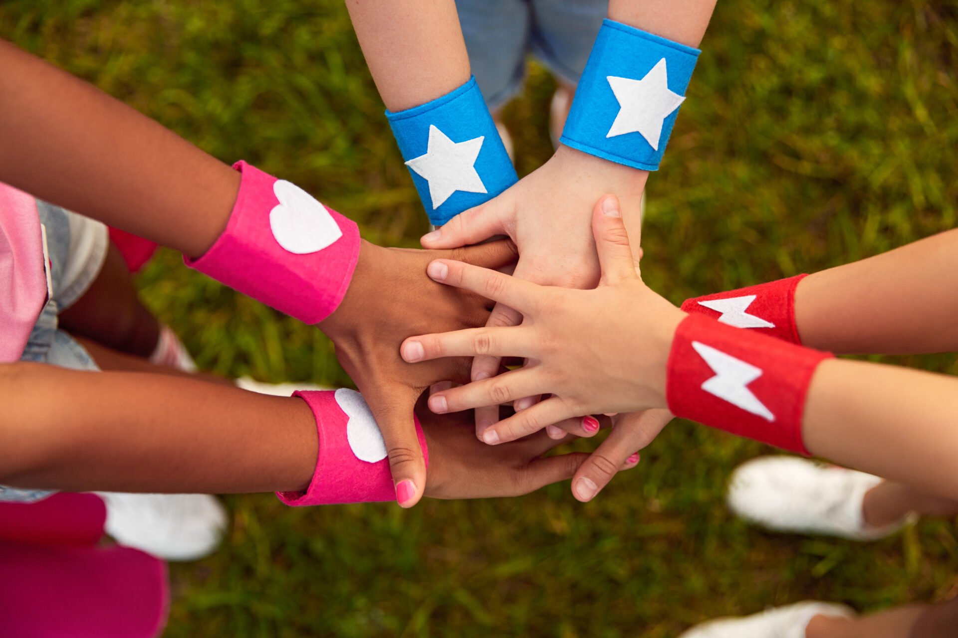 diverse children with superhero bracelets stacking 2022 11 23 00 45 28 utc