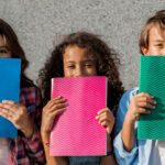 happy multiethnic school kids holding notebooks cl 2022 04 20 16 56 58 utc