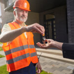 male construction worker passing keys to house 2022 01 05 16 07 33 utc