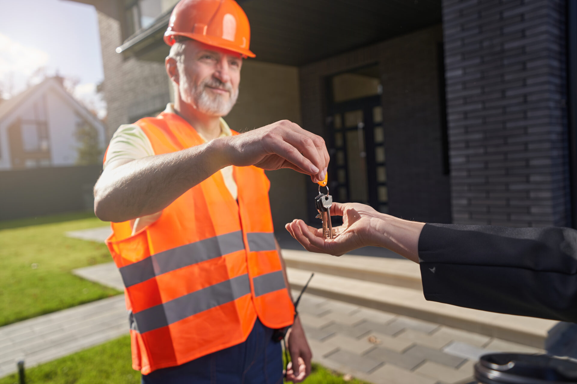 male construction worker passing keys to house 2022 01 05 16 07 33 utc